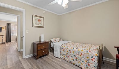 A cozy resident bedroom in the facility.