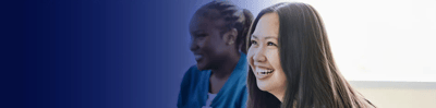 Two smiling women in a friendly environment