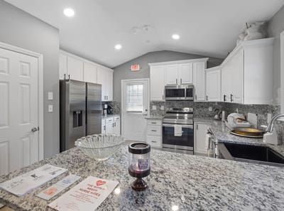 Bright interior kitchen space with modern appliances.