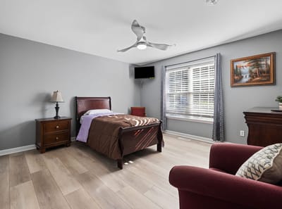 Private resident room with bed and furniture
