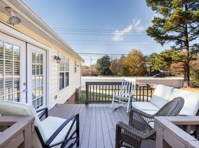 Outdoor seating area with patio chairs.