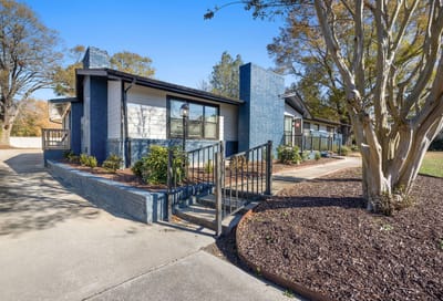 Exterior view of the facility with landscaping.