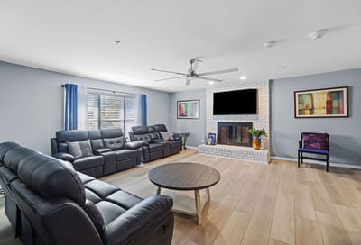 Comfortable lounge area with seating and fireplace.