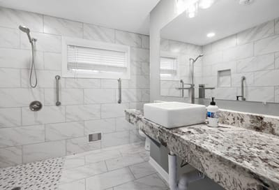 Modern bathroom with marble tiles and vanity