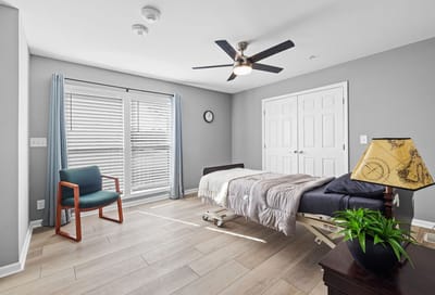 Comfortable resident bedroom with natural light
