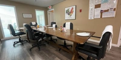 Dining room setup with tables and chairs