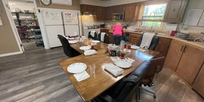 Dining area with residents enjoying a meal.