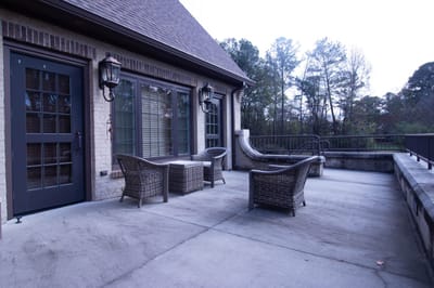 Patio area with outdoor seating near the facility