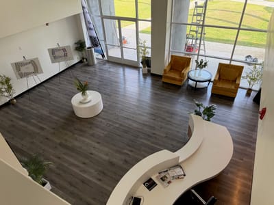 Bright, spacious lobby with seating and plants