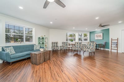 Interior common area with seating and wooden flooring