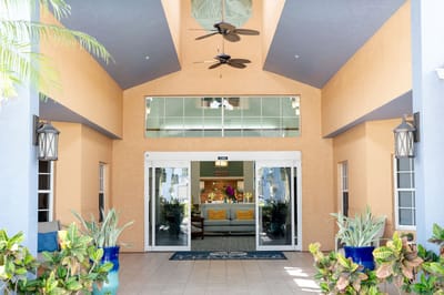 Exterior entrance of Barrington Terrace with seating area