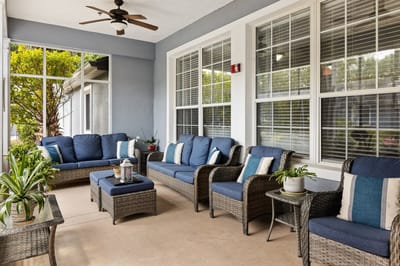 Outdoor seating area with sofas and plants