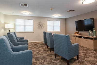 Cozy common area with comfortable blue chairs