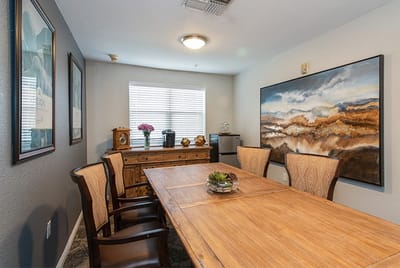 Common area with dining table and artwork
