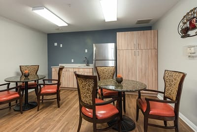 Cozy common seating area with tables and chairs