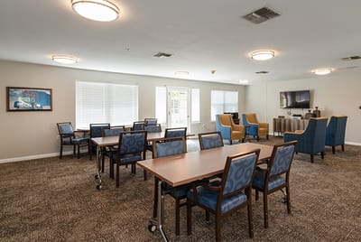 Common area with tables and seating for residents