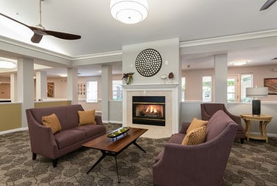 Common area with seating and fireplace