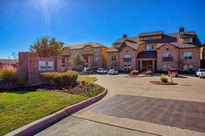 Exterior view of HomeTowne at Garland facility entrance