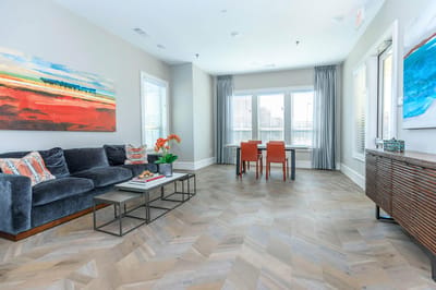 Bright lounge area with comfortable seating and artwork