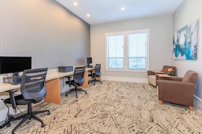 Interior of a common area with workstations and seating