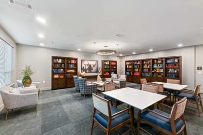 Bright common area with bookshelves and seating