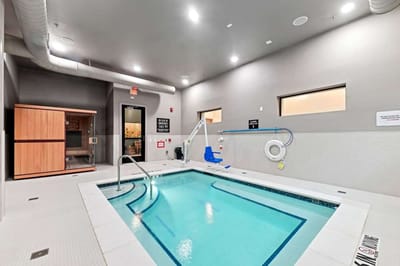 Indoor pool and sauna area at a senior living facility