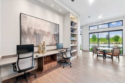 Contemporary common area with computers and seating
