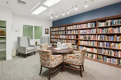 Cozy common area with bookshelves and seating