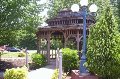 A gazebo surrounded by lush greenery