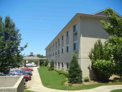 Exterior view of Garden of Hope facility with parking lot