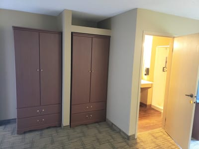 A private resident room with storage cabinets