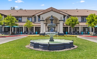 Exterior view of the facility with a fountain