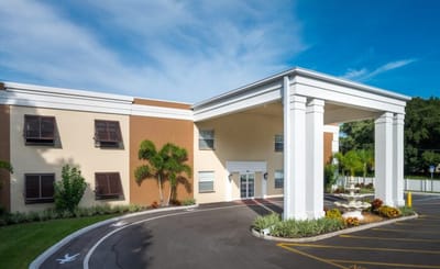 Exterior view of a senior living facility entrance.