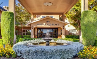 Exterior view of Springfield Place with a fountain.