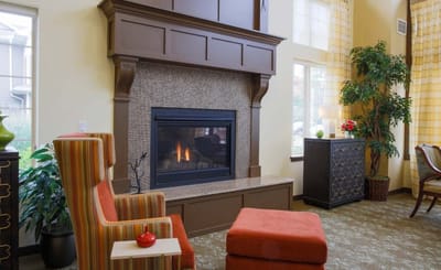 Cozy interior with fireplace and seating area.