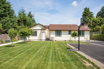 Exterior view of Mapleview Manor with landscaping