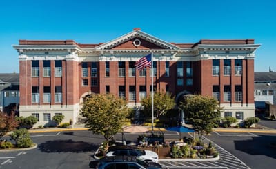 Exterior view of Hawthorn Court with landscaping.
