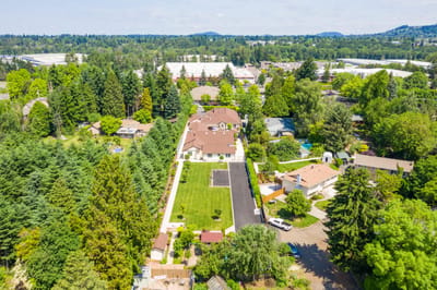 Aerial view of Mapleview Manor and surrounding greenery.