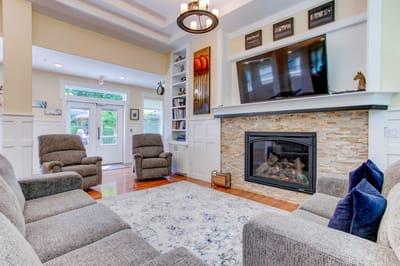Cozy common area with comfortable seating and a fireplace.