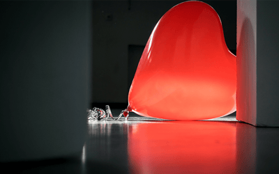 A large red balloon on the floor
