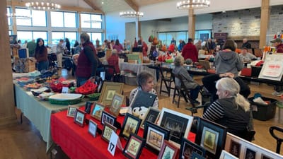 Residents enjoying a craft fair in a communal space.