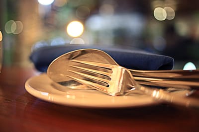 Close-up of dining utensils on a plate