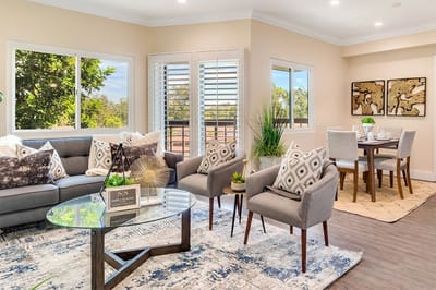 Modern living room area with dining setup.