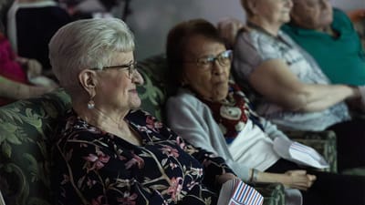 Residents enjoying a movie screening together.