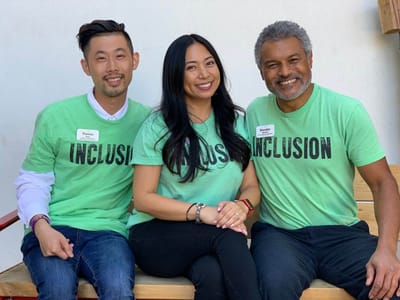 Three staff members promoting inclusion.