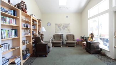 Cozy common area with bookshelves and seating