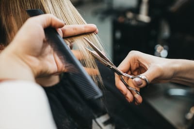Haircut being given at a salon