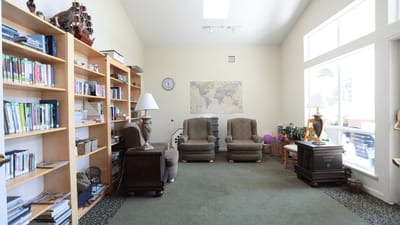 Common area with seating and bookshelves