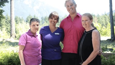 Staff members in a mountain setting