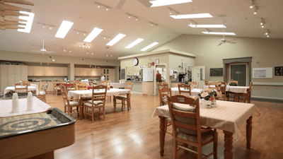 Bright dining room with tables set for meals